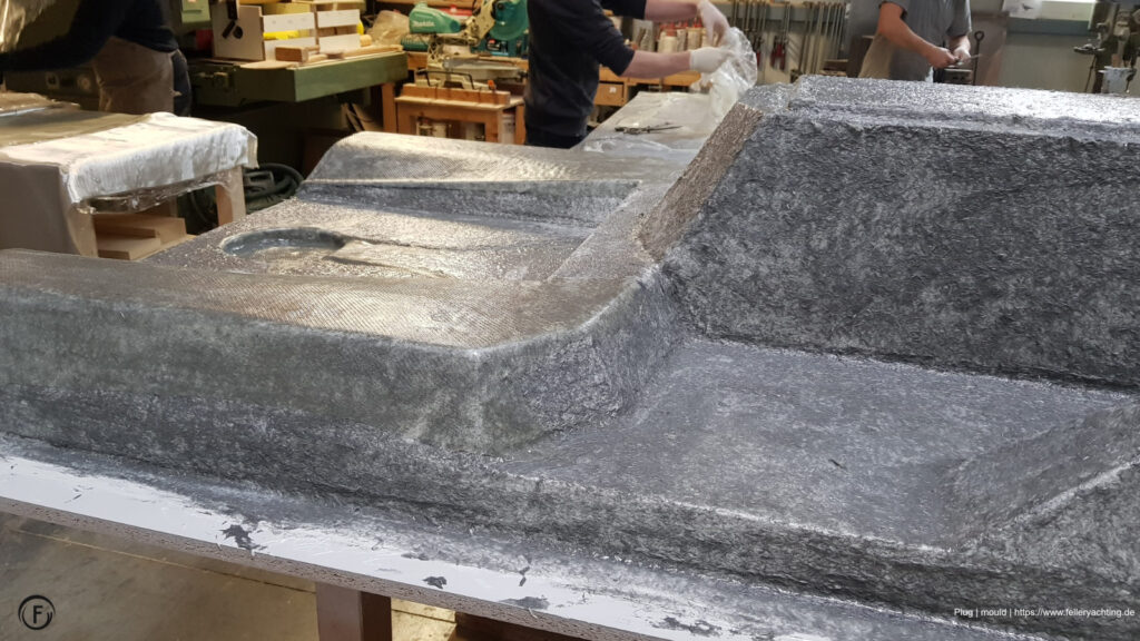 Laminating negative GRP mould from a wooden plug.